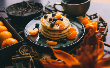 a view of a stack of pancakes with a fruit toppingの写真素材