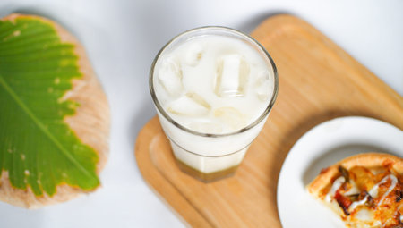 an ice milk and a slice of pizza served as a breakfast menu