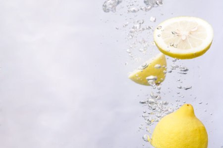 an orange dropped into freshwater splashing water