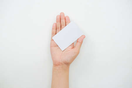 hand holds an empty white space on a white backgroundの写真素材