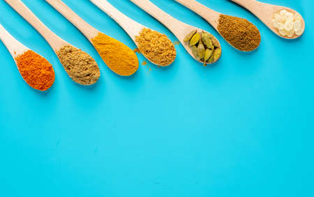 colorful spices in spoonsの写真素材