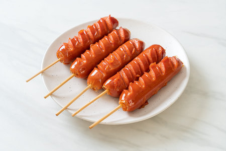 fried sausage skewer on plate