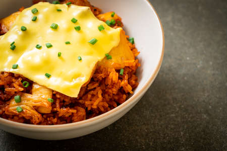 kimchi fried rice with pork and topped cheeseの写真素材