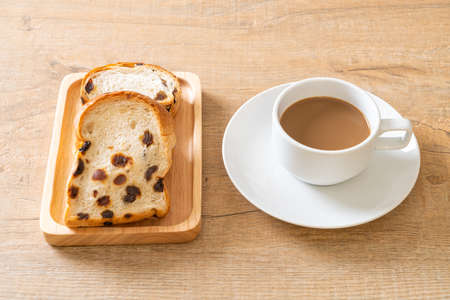 raisin bread with coffee cupの写真素材