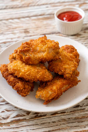 fried chicken wings with ketchupの写真素材