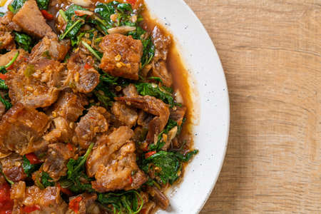 stir-fried crispy pork belly and basilの写真素材