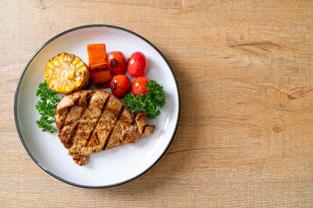 grilled and barbecue fillet pork steak with vegetableの写真素材