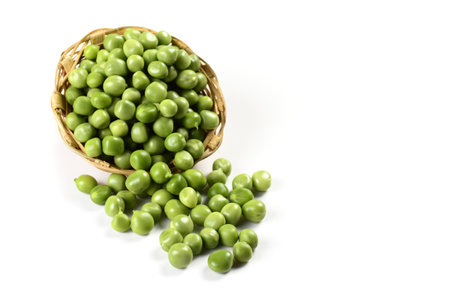 Fresh Green Peas in basket on white backgroundの写真素材
