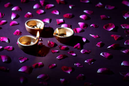 Traditional clay diya lamps lit during Diwali celebrationの写真素材