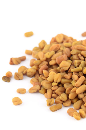 Fenugreek seeds isolated on white backgroundの写真素材