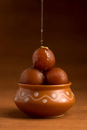 Gulab Jamun in clay pot. Indian Dessert or Sweet Dishの写真素材