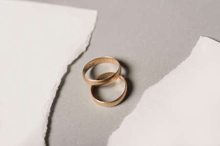 broken paper with golden wedding rings. High quality and resolution beautiful photo conceptの写真素材