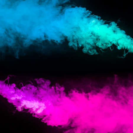 blue pink smoke effect black backgroundの写真素材