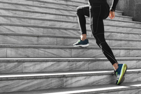 side view man athletic wear exercising stairs outdoors