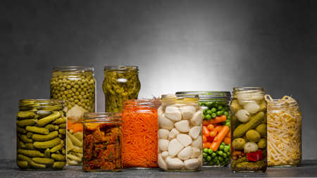 front view assortment vegetables pickled glass jars. High quality and resolution beautiful photo conceptの写真素材