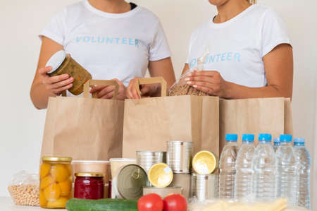 volunteers with bags provisions water donation. Resolution and high quality beautiful photoの写真素材