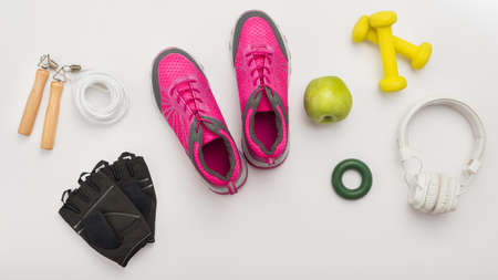 top view sneakers with gym gloves headphones. High quality and resolution beautiful photo conceptの写真素材