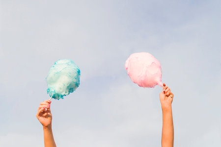 hands holding cotton candy