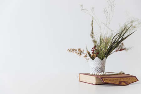 koran book flowers vase . High quality and resolution beautiful photo conceptの写真素材