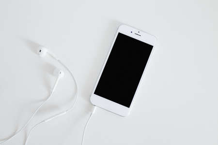 smartphone with earphone isolated white background. High quality beautiful photo conceptの写真素材