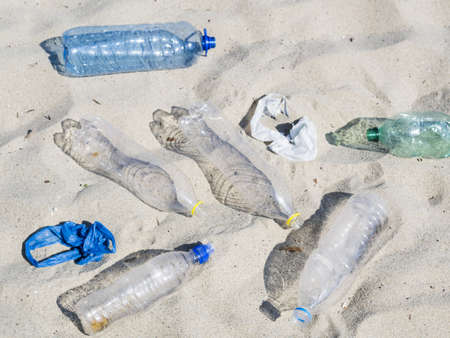 empty plastic water bottles plastic bag sand. High quality and resolution beautiful photo conceptの写真素材