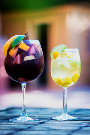 red and white wine sangria cocktail drinks on tableの写真素材