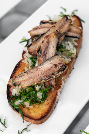 Portuguese tiborna open toast sandwich tapas with sardine and onion garlic