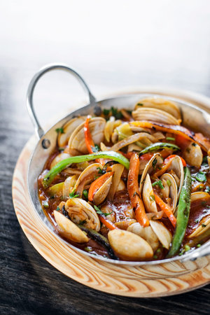 gourmet clam and vegetable seafood stew in spicy tomato sauceの写真素材