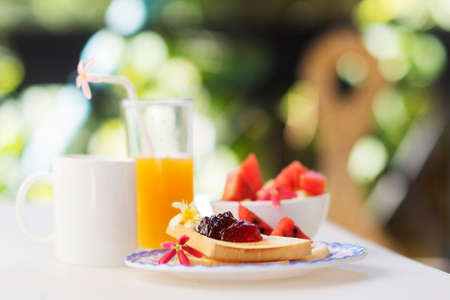 jam toast juice fruit and coffee setの写真素材