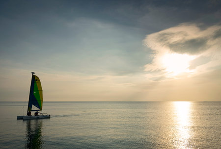 sailing boat at sunset in phuket coast thailand