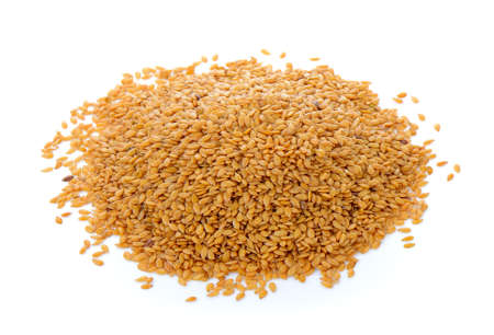 Flax seeds heap isolated on white backgroundの写真素材