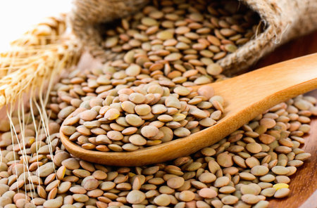 lentils in wood spoon