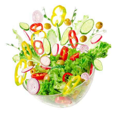 Fresh vegetable salad in transparent bowl with flying ingredients isolated on white. Proper nutrition.の写真素材