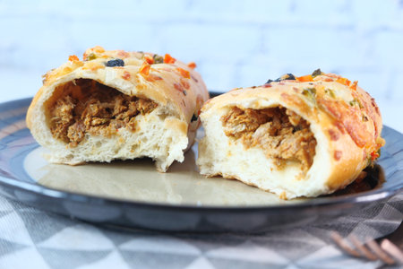 slice of sandwich with meat on plateの写真素材