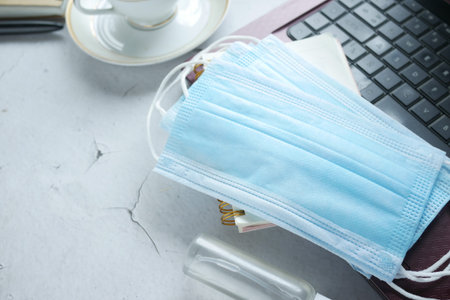 Close up of blue surgical masks on table.の写真素材