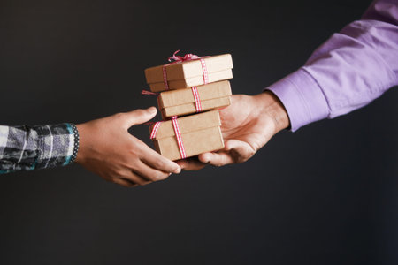 men hand giving homemade gift box .