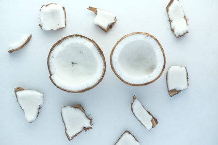 slice of fresh coconut on a table cloth .