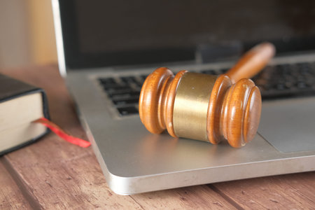 close up of a gavel on laptop on table ,の写真素材