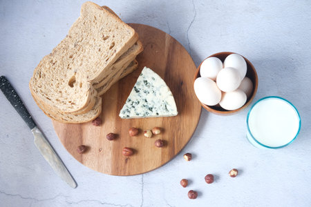 Close up of cheese and almond nut on table