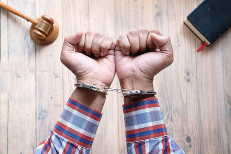 hands of a man with handcuffs close up