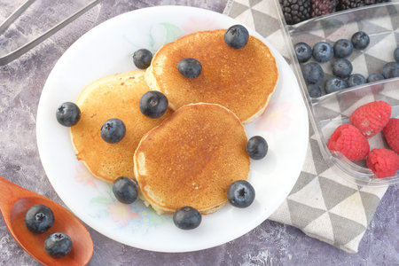 fresh blue berry on pan cake on table