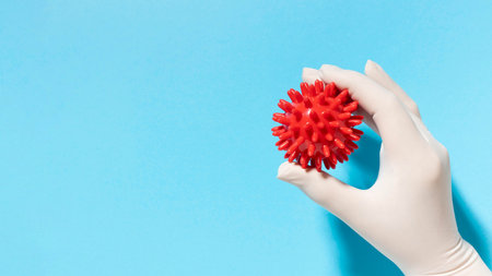 top view hand with glove holding virus with copy space. Resolution and high quality beautiful photoの写真素材