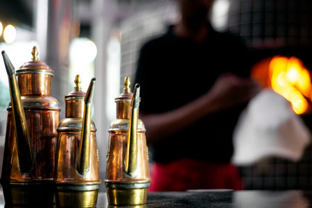 classic olive oil copper cruet traditional dispenser detail in italian restaurant