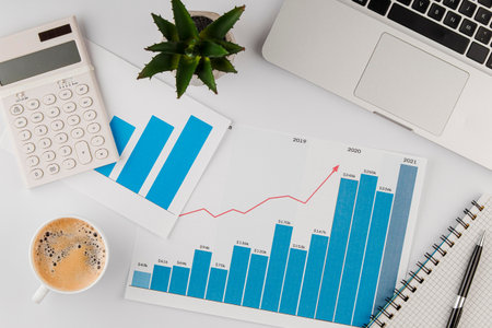 top view office desk with growth chart coffee cup. Resolution and high quality beautiful photo
