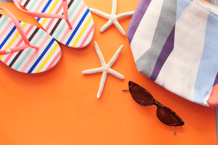 flat composition of summer beach accessories on tableの写真素材