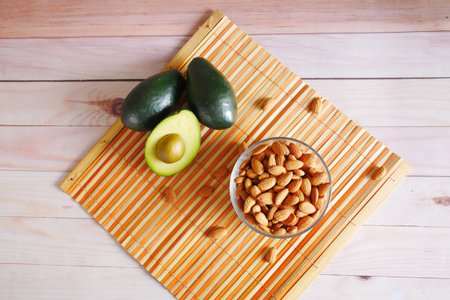top view of avocado and almond nut on table ,