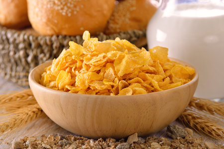 corn flakes in wood bowl