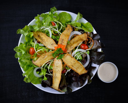 Mushroom salad on the white plateの写真素材