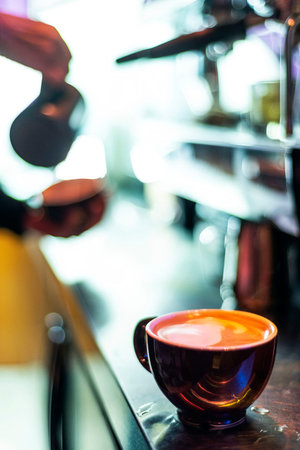 making espresso coffee close up detail with modern cafe machine