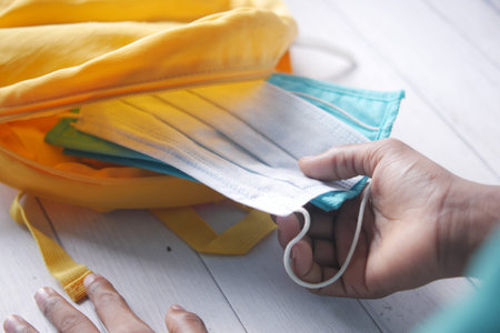 Student school bag pack with sanitizer, a face mask